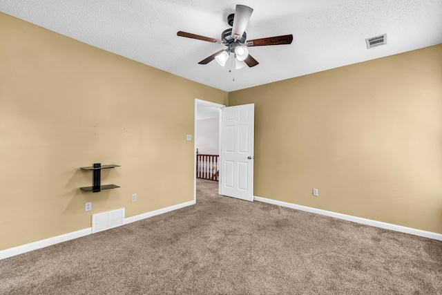 858 Gunnison Dr, Collierville, TN 38017 - unfurnished room featuring ceiling fan, carpet floors, baseboards, and a textured ceiling