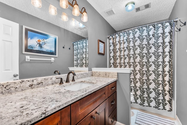 858 Gunnison Dr, Collierville, TN 38017 - full bath with a textured ceiling, vanity, tile patterned floors, and a shower with curtain