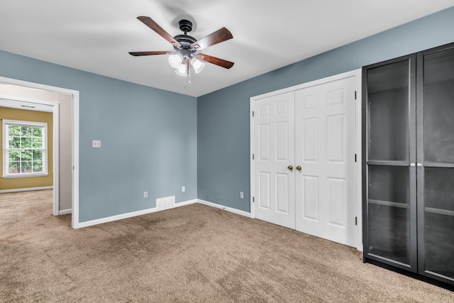 858 Gunnison Dr, Collierville, TN 38017 - unfurnished bedroom with carpet, baseboards, a ceiling fan, and a closet