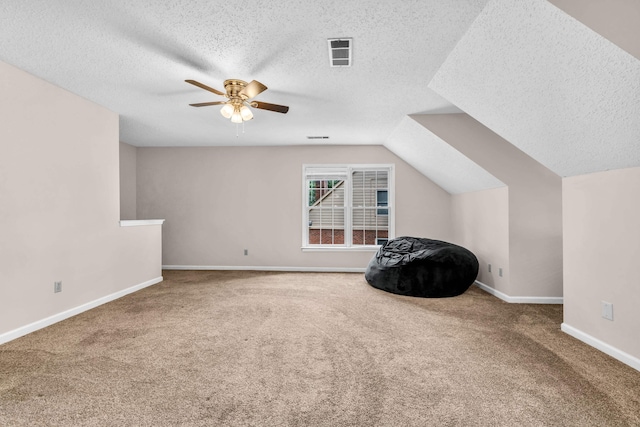 858 Gunnison Dr, Collierville, TN 38017 - additional living space with carpet floors, a ceiling fan, a textured ceiling, baseboards, and vaulted ceiling