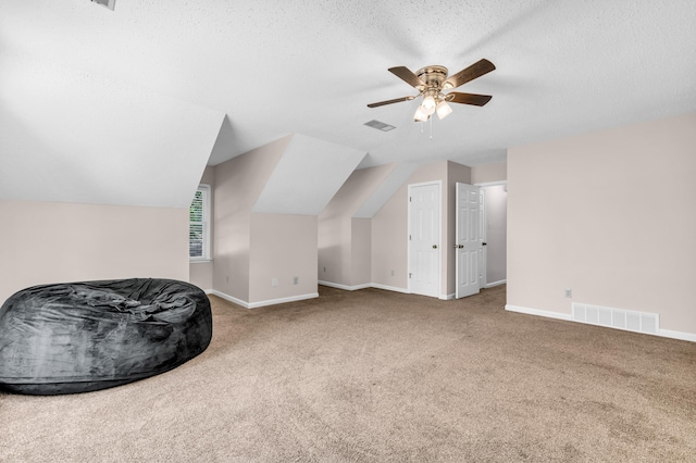 858 Gunnison Dr, Collierville, TN 38017 - bonus room with ceiling fan, carpet flooring, baseboards, a textured ceiling, and vaulted ceiling