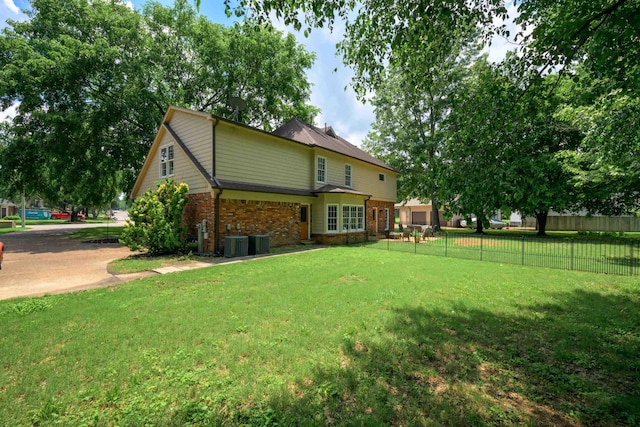 858 Gunnison Dr, Collierville, TN 38017 - back of property featuring brick siding and central AC