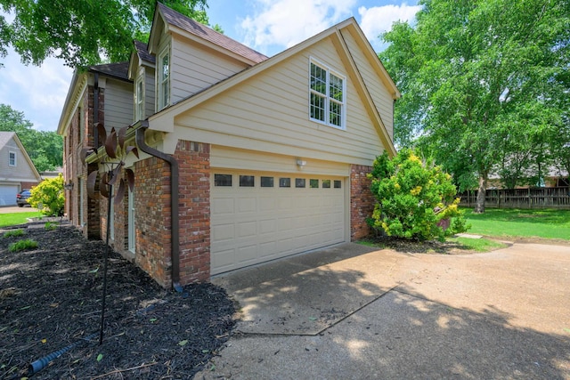 858 Gunnison Dr, Collierville, TN 38017 - view of side of home with brick siding, driveway, and roof with shingles