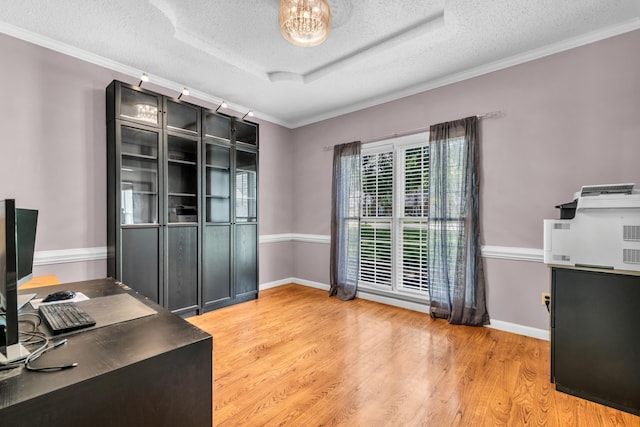 858 Gunnison Dr, Collierville, TN 38017 - unfurnished office with a textured ceiling, light wood-type flooring, crown molding, and baseboards
