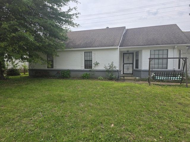 7129 Butternut Dr, Memphis, TN 38133 - view of front facade featuring a front yard, roof with shingles, and brick siding