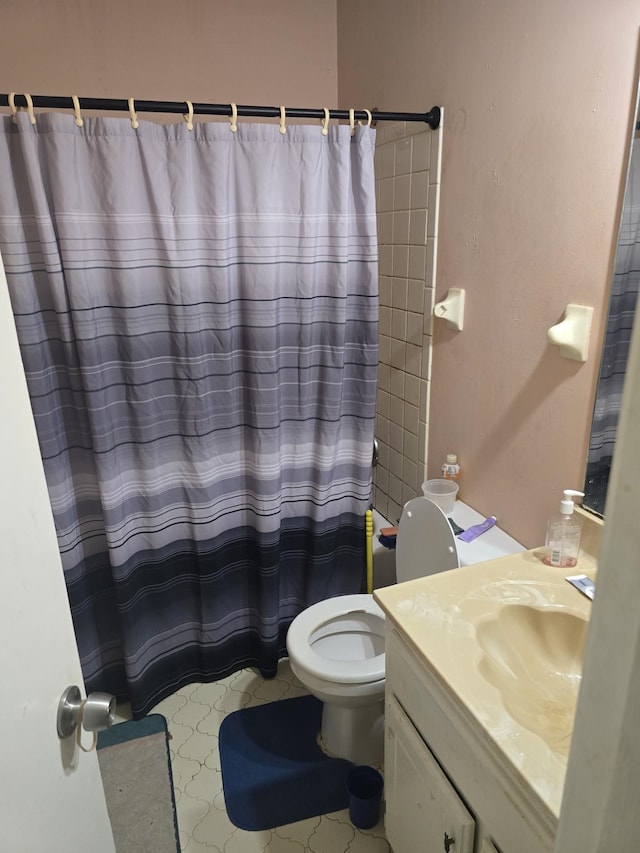 7129 Butternut Dr, Memphis, TN 38133 - bathroom with toilet, vanity, and a shower with shower curtain