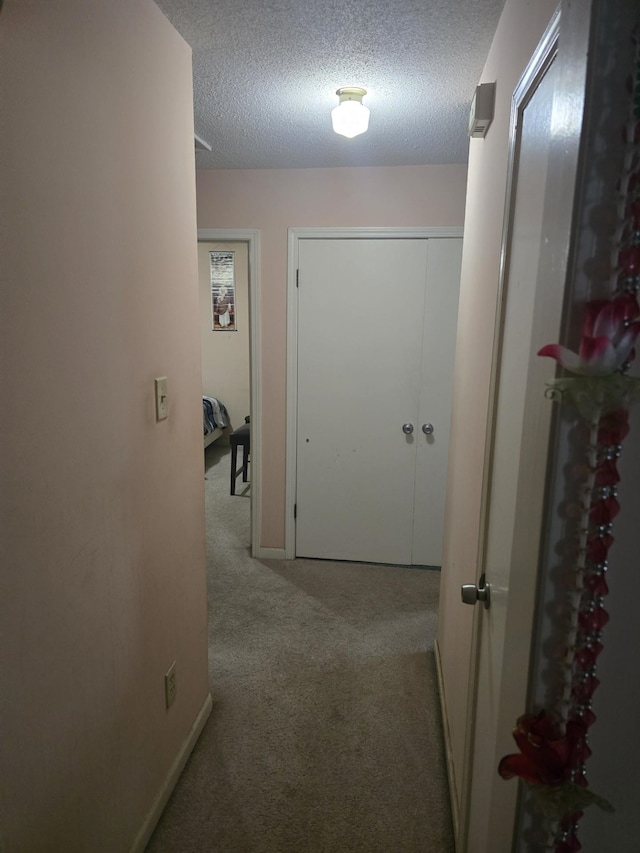 7129 Butternut Dr, Memphis, TN 38133 - hallway featuring carpet floors and a textured ceiling