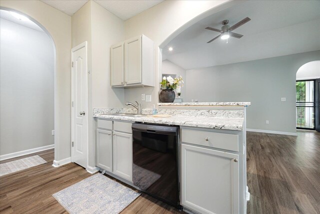 kitchen featuring black dishwasher, arched walkways, a sink, dark wood finished floors, and lofted ceiling