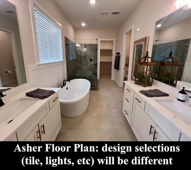 4844 Lyla Ln, Collierville, TN 38017 - bathroom with a stall shower, a freestanding bath, recessed lighting, tile patterned floors, and two vanities