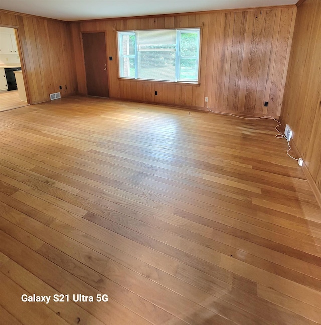 5551 Derron Dr, Memphis, TN 38115 - spare room featuring light wood finished floors and wooden walls