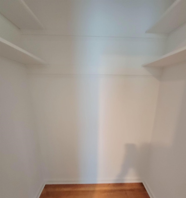 5551 Derron Dr, Memphis, TN 38115 - walk in closet featuring wood finished floors