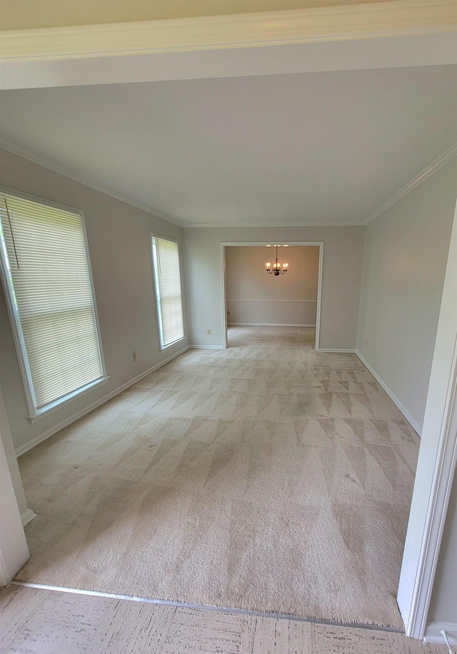 5551 Derron Dr, Memphis, TN 38115 - carpeted empty room featuring ornamental molding, a chandelier, and baseboards