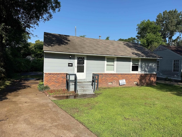 1591 Michael St, Memphis, TN 38111 - view of front of property with brick siding, a front lawn, and roof with shingles