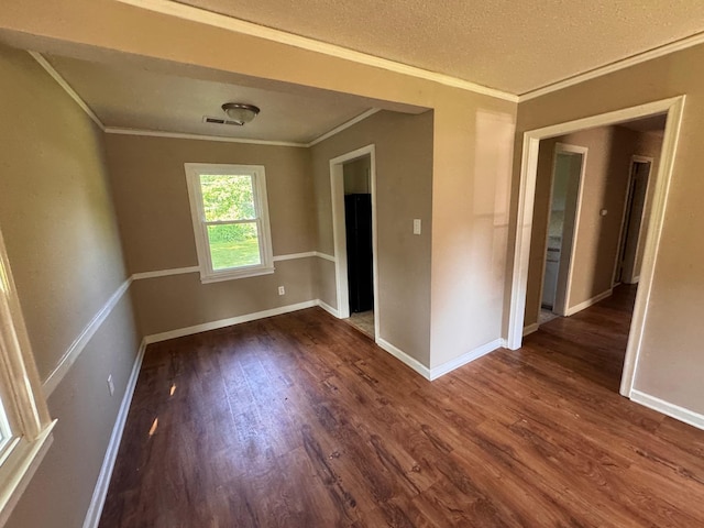 1591 Michael St, Memphis, TN 38111 - empty room with crown molding, dark wood finished floors, baseboards, and a textured ceiling
