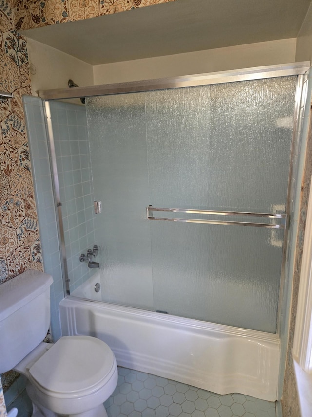 137 Perkins Ext, Memphis, TN 38117 - bathroom with toilet, enclosed tub / shower combo, and tile patterned flooring