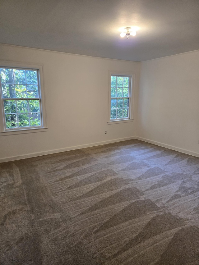 137 Perkins Ext, Memphis, TN 38117 - unfurnished room with dark carpet and baseboards