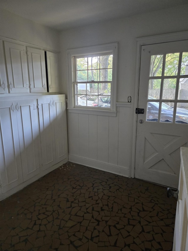 137 Perkins Ext, Memphis, TN 38117 - doorway to outside featuring a wainscoted wall