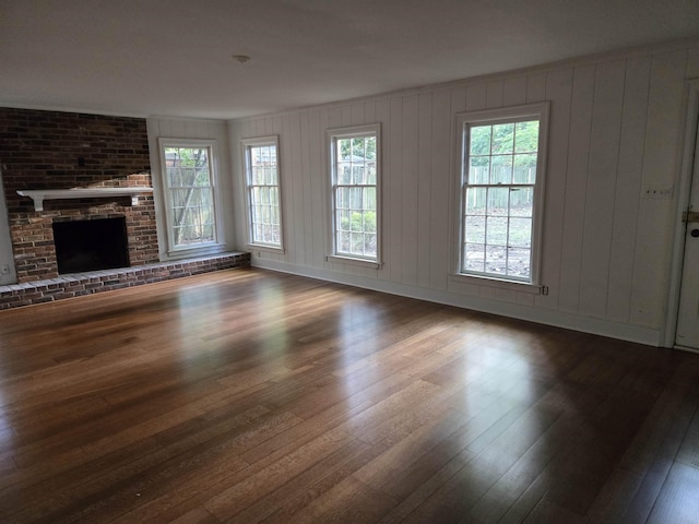 137 Perkins Ext, Memphis, TN 38117 - unfurnished living room with wood finished floors, plenty of natural light, and a fireplace