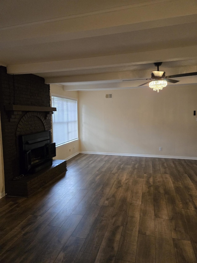 3403 Lynchburg St, Memphis, TN 38134 - unfurnished living room with beamed ceiling, a ceiling fan, dark wood-type flooring, baseboards, and a fireplace