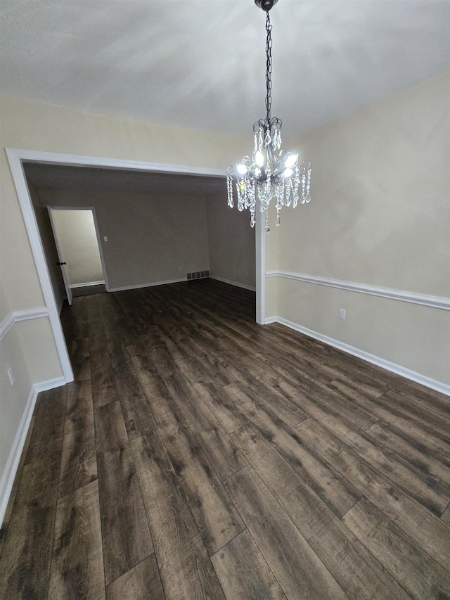 3403 Lynchburg St, Memphis, TN 38134 - unfurnished dining area with dark wood-style floors, a chandelier, and baseboards