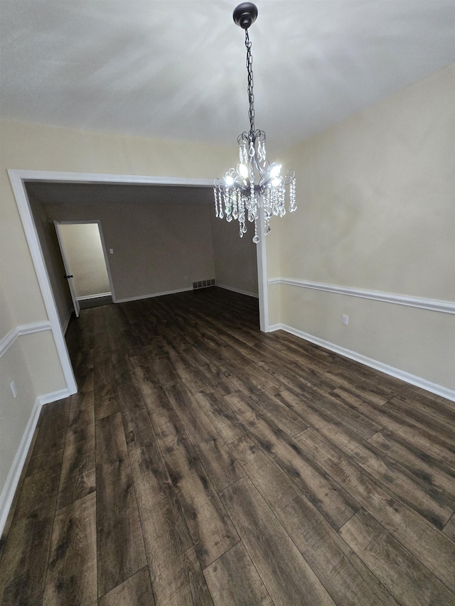 3403 Lynchburg St, Memphis, TN 38134 - unfurnished dining area featuring dark wood-style floors, a chandelier, and baseboards