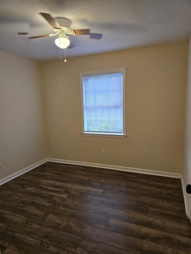 3403 Lynchburg St, Memphis, TN 38134 - unfurnished room with dark wood finished floors, ceiling fan, and baseboards