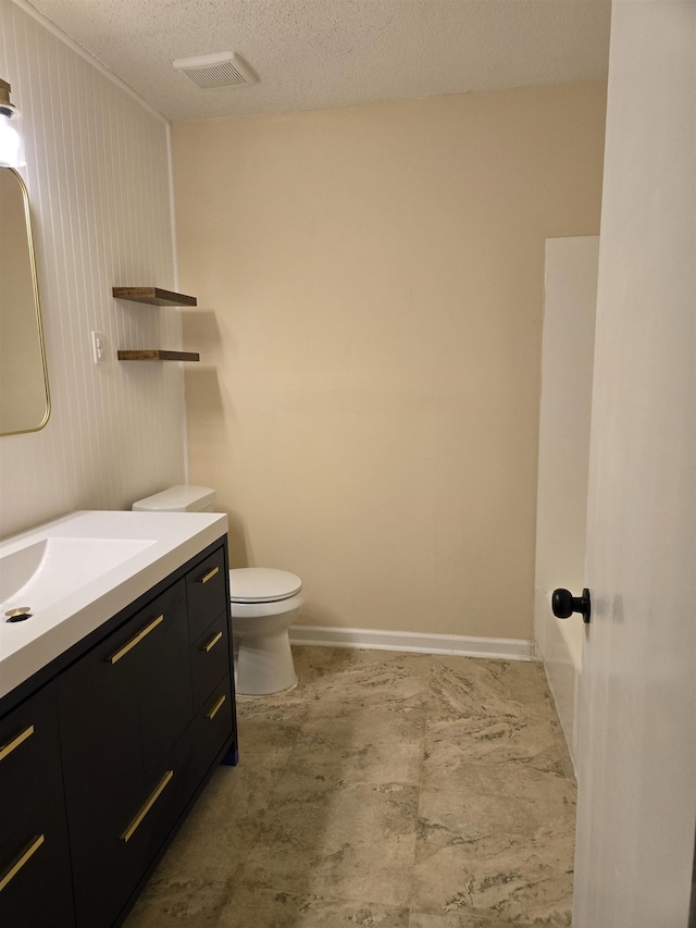 3403 Lynchburg St, Memphis, TN 38134 - bathroom featuring vanity, a textured ceiling, and toilet