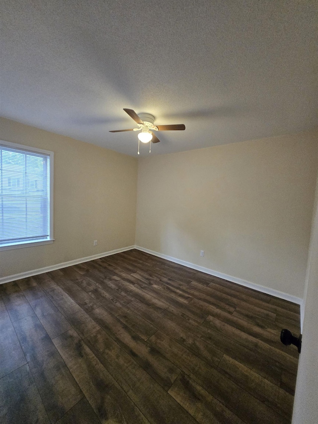 3403 Lynchburg St, Memphis, TN 38134 - unfurnished room featuring dark wood finished floors, a ceiling fan, baseboards, and a textured ceiling