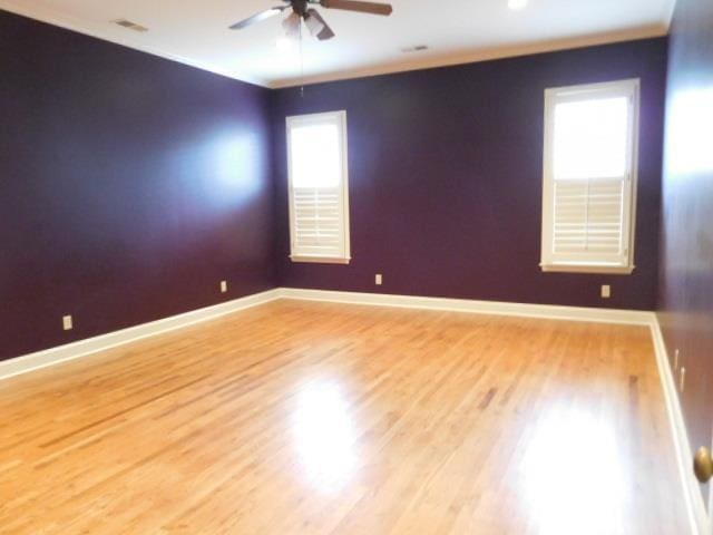 9305 Enclave Green Ln, Germantown, TN 38139 - spare room featuring a ceiling fan, baseboards, and wood finished floors