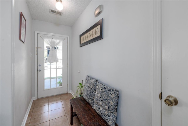 4357 Water Briar Rd, Millington, TN 38053 - entryway with a textured ceiling, light tile patterned floors, and baseboards