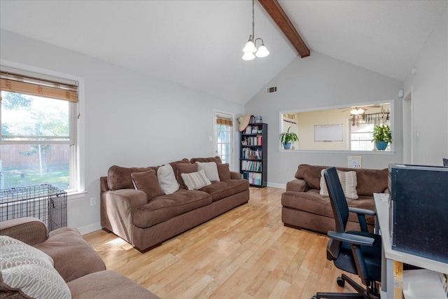 4357 Water Briar Rd, Millington, TN 38053 - living area with beamed ceiling, light wood-style floors, healthy amount of natural light, baseboards, and high vaulted ceiling