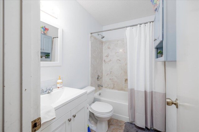 4357 Water Briar Rd, Millington, TN 38053 - full bathroom with toilet, vanity, shower / bathtub combination with curtain, and a textured ceiling