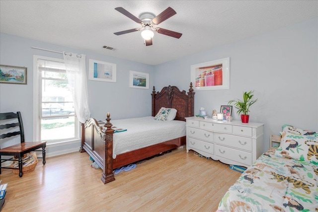4357 Water Briar Rd, Millington, TN 38053 - bedroom with light wood finished floors, multiple windows, a ceiling fan, and baseboards