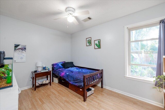 4357 Water Briar Rd, Millington, TN 38053 - bedroom featuring light wood-style floors, multiple windows, and baseboards
