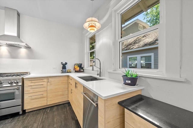 2086 Felix Ave, Memphis, TN 38104 - kitchen featuring stainless steel appliances, wall chimney exhaust hood, light brown cabinets, a sink, and modern cabinets
