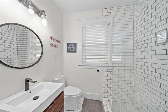 2086 Felix Ave, Memphis, TN 38104 - full bathroom featuring vanity, tile patterned flooring, tiled shower, and toilet