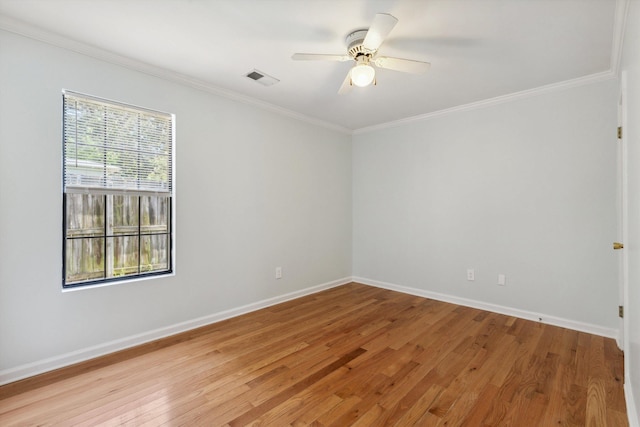 1000 S Cox St, Memphis, TN 38104 - empty room featuring crown molding, light wood finished floors, baseboards, and a ceiling fan