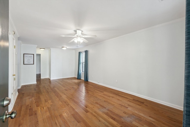 1000 S Cox St, Memphis, TN 38104 - empty room featuring a ceiling fan, ornamental molding, light wood-type flooring, and baseboards