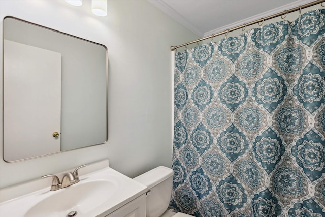 1000 S Cox St, Memphis, TN 38104 - bathroom with toilet, crown molding, vanity, and curtained shower