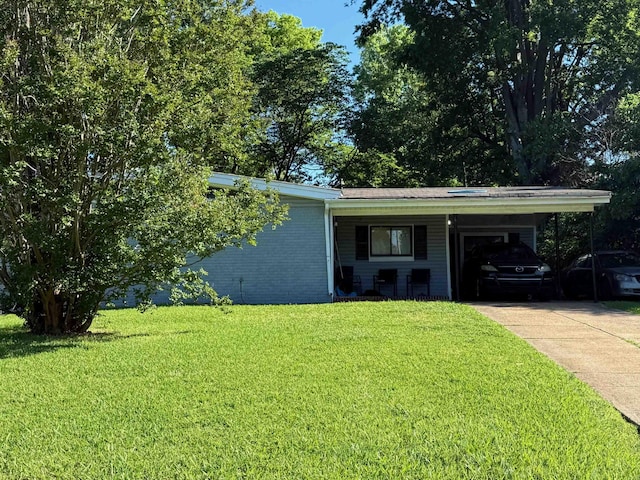 2714 Nix Cv, Memphis, TN 38127 - view of front of property featuring a carport, a front lawn, driveway, and brick siding