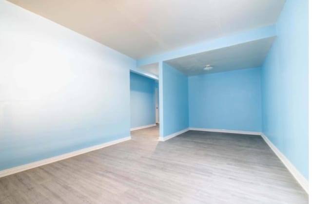 12580 Macon Rd, Tn, TN 38017 - empty room with wood finished floors and baseboards