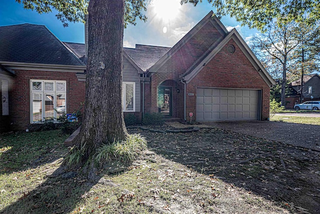 8451 Donegal Cv, Germantown, TN 38139 - view of front facade with brick siding, driveway, and an attached garage