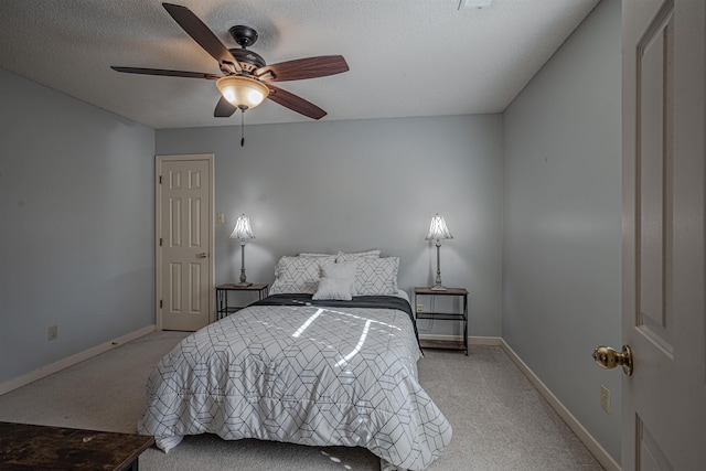8451 Donegal Cv, Germantown, TN 38139 - bedroom with light colored carpet, baseboards, a ceiling fan, and a textured ceiling