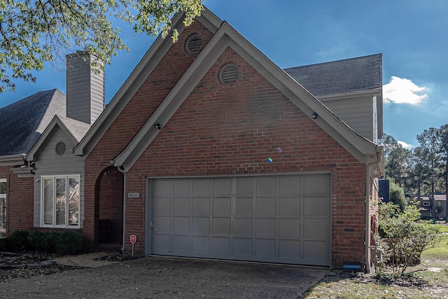 8451 Donegal Cv, Germantown, TN 38139 - view of side of property featuring brick siding, driveway, and a chimney