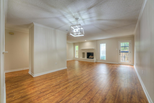 1823 Allenby Green Dr Unit 6, Germantown, TN 38139 - unfurnished living room with crown molding, wood finished floors, a textured ceiling, and baseboards