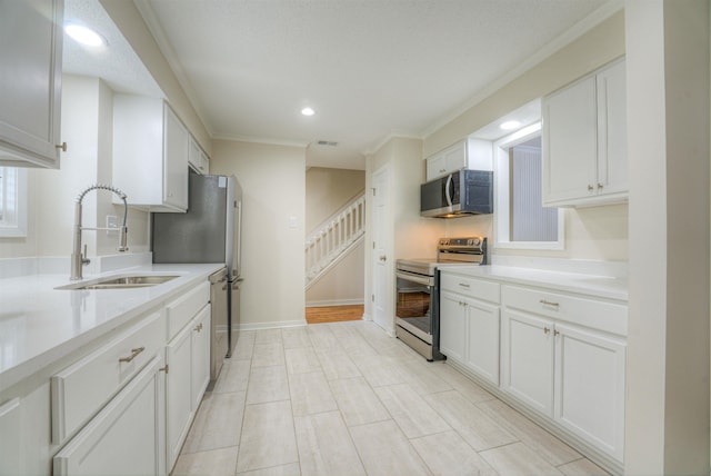 1823 Allenby Green Dr Unit 6, Germantown, TN 38139 - kitchen featuring appliances with stainless steel finishes, a sink, white cabinetry, light countertops, and recessed lighting