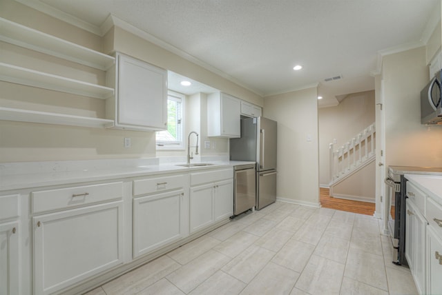 1823 Allenby Green Dr Unit 6, Germantown, TN 38139 - kitchen with stainless steel appliances, a sink, crown molding, light countertops, and white cabinets