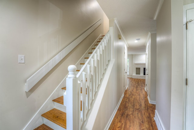 1823 Allenby Green Dr Unit 6, Germantown, TN 38139 - stairway with wood finished floors, baseboards, a textured ceiling, and a fireplace