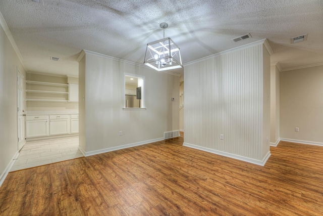1823 Allenby Green Dr Unit 6, Germantown, TN 38139 - unfurnished dining area with crown molding, wood finished floors, a chandelier, baseboards, and a textured ceiling