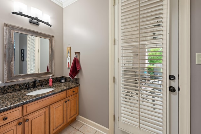 9245 Forest Estates Cv, Germantown, TN 38139 - bathroom with tile patterned flooring, vanity, crown molding, and baseboards